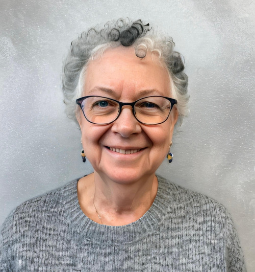 Phyllis Gagnon smiling with glasses, close to the camera